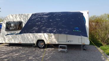 Front view of caravan with canopy awning attached