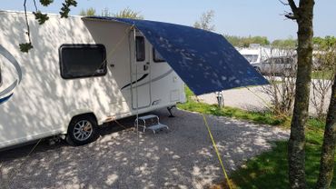 Caravan in the sun with canopy awning attached