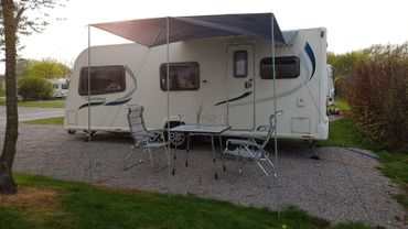 Caravan with canopy awning attached