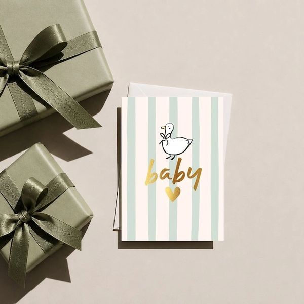 Baby greeting card with gifts.