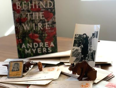 Letters from soldiers with 1940s photo and Behind the Wire book