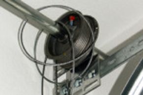 Garage door lift cable off of the cable drum.