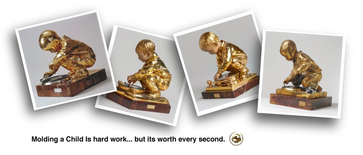 Golden sculptures of a child playing with a record player.