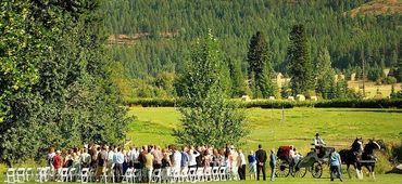 Wedding ceremony with horse-drawn carriage at Stillwater Ranch.