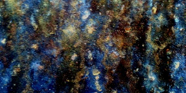 Close-up of a textured surface with blue and brown hues.