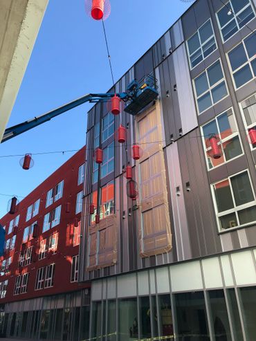 Exterior painting of a building using a Genie