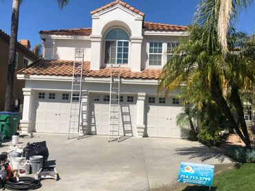 exterior painting of a 2 stories house