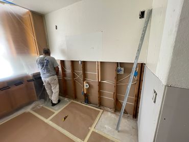 painting contractor repairing drywall