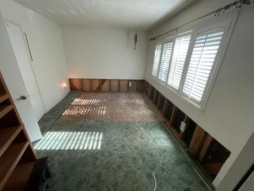 white room needing drywall maintainance