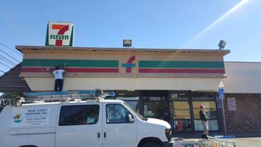 exterior painting of a seven eleven store