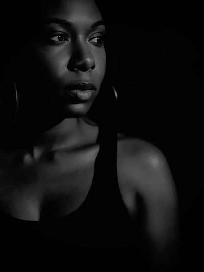 Black and white portrait of a woman looking to the side.