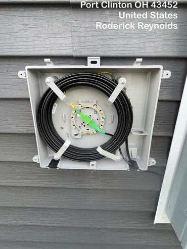 Fiber enclosure mounted on customer’s home.