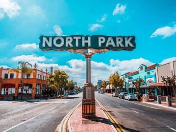 North Park street sign in a sunny urban area.