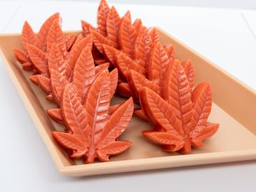 Red irie chews laid out on a platter