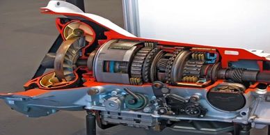 Detailed cutaway of a mechanical transmission system showing gears and components.