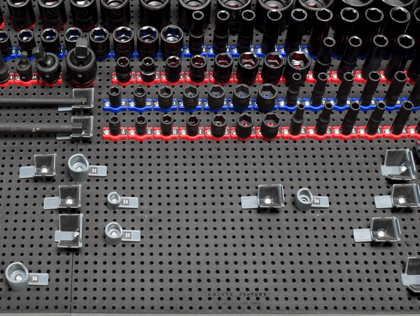 tool grid ratchet and socket holders on a tool grid board holding tools with some tools missing