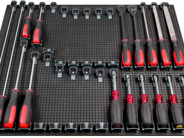 tool grid screw driver holders holding screwdrivers with some missing on a tool grid board