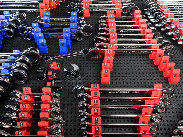 close up of labeled SAE and metric wrench holders holding wrenches on a toolgrid board
