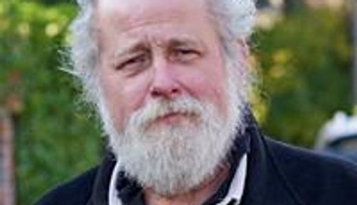 Image of an old man with long white hairs