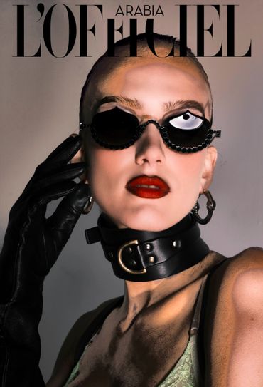 Edgy fashion portrait with bold accessories and striking red lips.