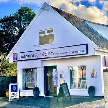 Small white building with Limehouse Art Gallery sign and open today boards.