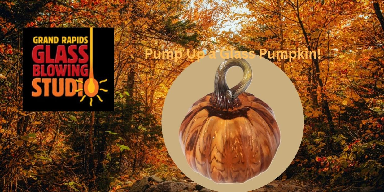 Glass pumpkin on autumn forest background with studio logo.