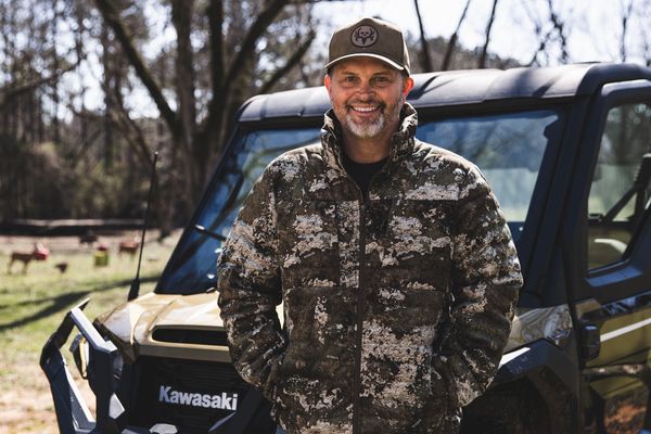 Michael Waddell in front of Kawasaki UTV