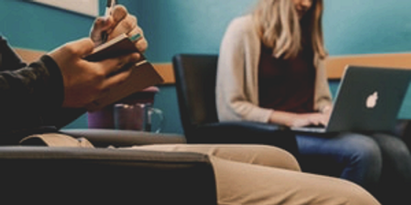 Supervisor taking notes during supervision of LMFT-Associate or LPC-Associate