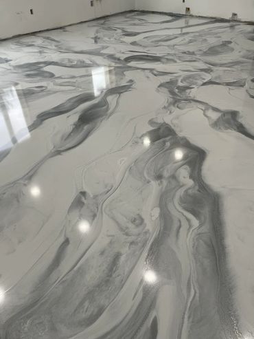 Metallic epoxy floor installed in Glen Arbor, MI by Full Spectrum Coatings.