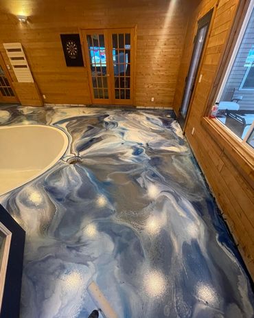 Residential metallic epoxy floor installed by Full Spectrum Coatings in Williamsburg, MI.
