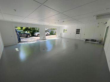 Solid color epoxy garage floor installed by Full Spectrum Coatings in Traverse City, MI.