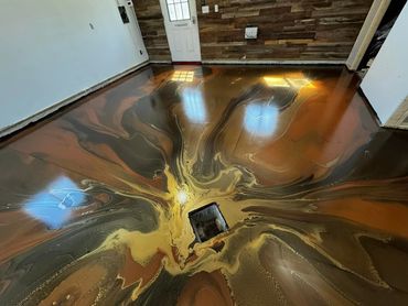 Metallic epoxy garage floor installed in Traverse City, MI by Full Spectrum Coatings.