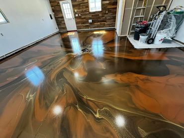 Metallic epoxy garage floor installed in Traverse City, MI by Full Spectrum Coatings.
