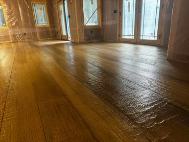 Wood plank residential epoxy floor installed by Full Spectrum Coatings in Empire, MI.