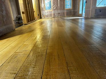 Wood plank residential epoxy floor installed by Full Spectrum Coatings in Empire, MI.