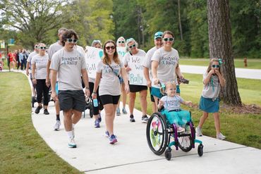 Community walking together at the Spina Bifida Walk-N-Roll charity event in Charleston, SC