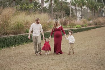 Elizabeth Grace Smith and her family walking hand in hand in the Charleston, SC