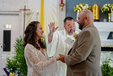 Charleston wedding couple exchanging vows in a church ceremony