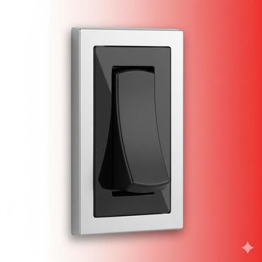 Modern black and silver rocker light switch on a red and white wall.