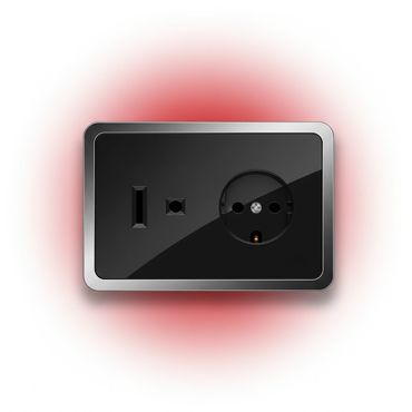 Modern black electrical socket with multiple plug types and a red glowing background.