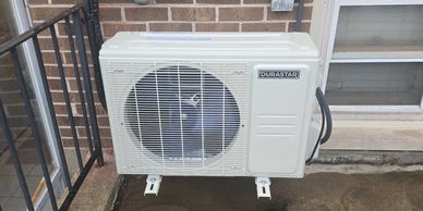 Outdoor Durastar air conditioning unit installed on a concrete surface.