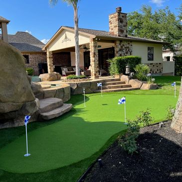 putting green around a pool with landscape turf as the collar