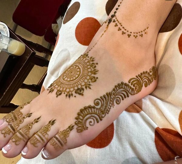 Full-coverage bridal henna design by a Southampton henna artist, detailed mehndi covers hands, arms,