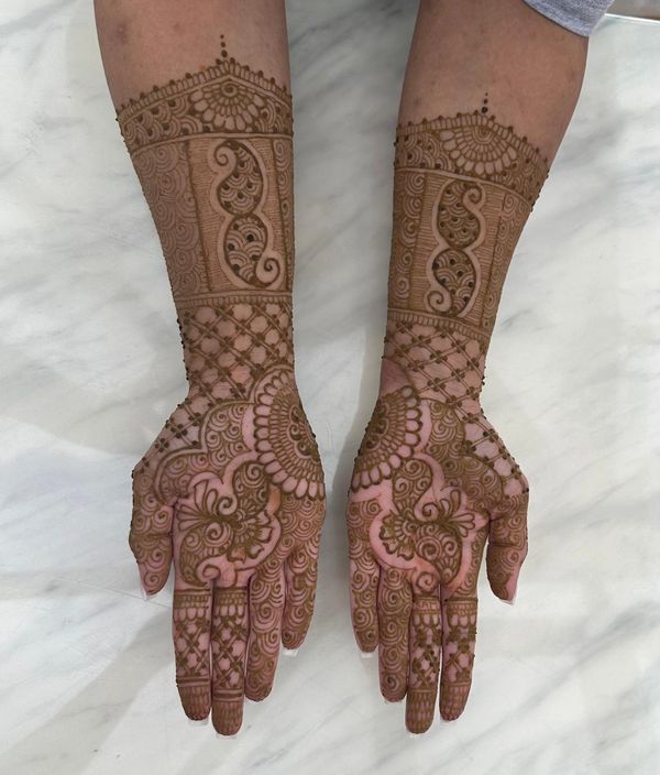 Full-coverage bridal henna design by a Southampton henna artist, detailed mehndi covers hands, arms,