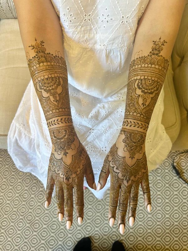 Full-coverage bridal henna design by a Southampton henna artist, detailed mehndi covers hands, arms,