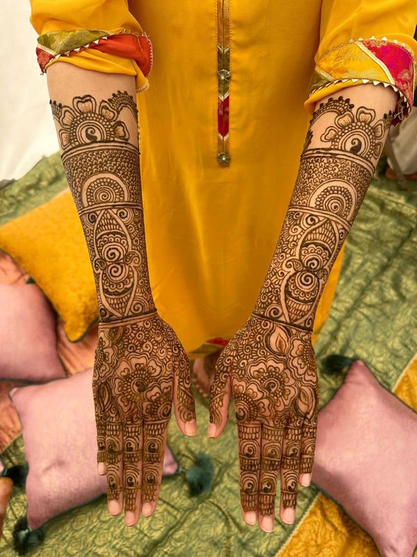 Full-coverage bridal henna design by a Southampton henna artist, detailed mehndi covers hands, arms,