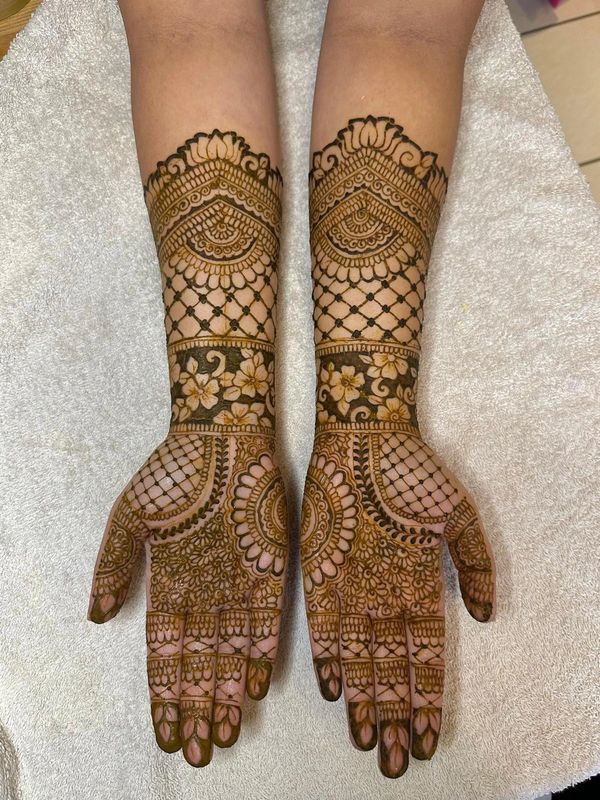 Full-coverage bridal henna design by a Southampton henna artist, detailed mehndi covers hands, arms,
