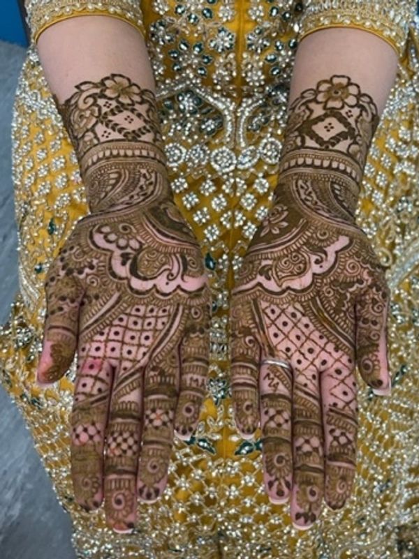 Full-coverage bridal henna design by a Southampton henna artist, detailed mehndi covers hands, arms,