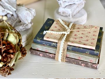 Paper-wrapped book bundle (shown) 