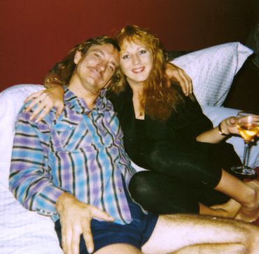 Joe Walsh and Kristin Casey, penthouse bedroom drinking wine, 1989